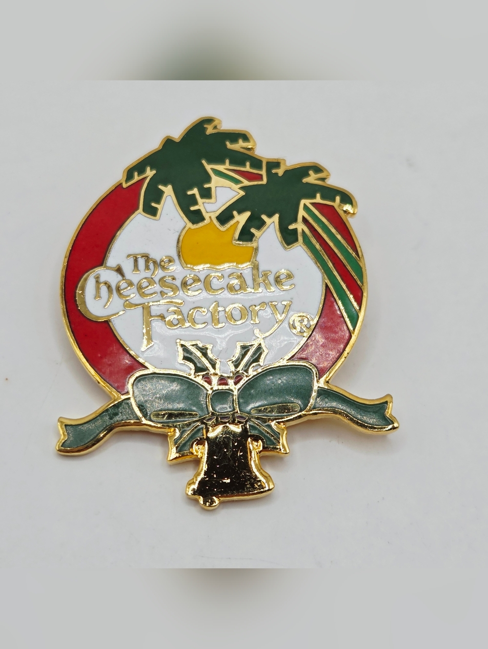 THE CHEESECAKE FACTORY PIN PALM TREE  BELL HOLIDAY LOGO RARE